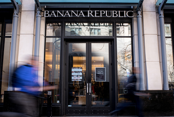 Pedestrians walk past a Banana Republic LLC store in Chicago, Illinois, U.S., on Friday, Feb. 19, 2016. The Gap Inc. is scheduled to release earnings figures on February 24. Photographer: Christopher Dilts/Bloomberg via Getty Images